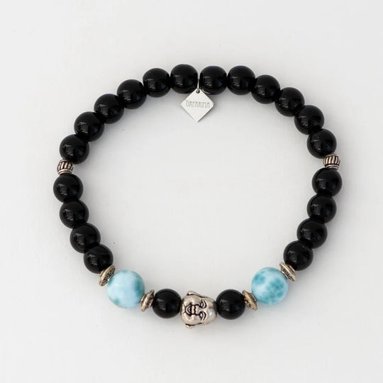 Bracelet en obsidienne avec deux perles de larimar de 11mm dediamètre et une breloque tête de bouddha.