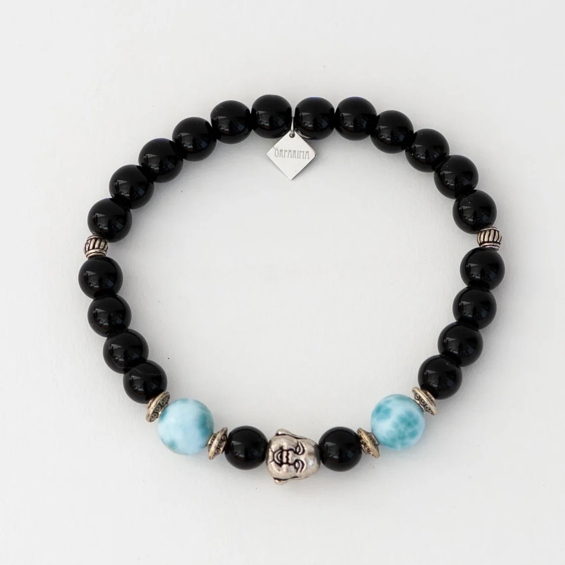 Bracelet en obsidienne avec deux perles de larimar de 11mm dediamètre et une breloque tête de bouddha.