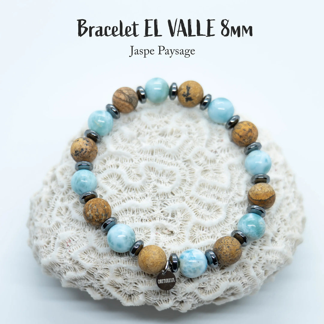 Bijou fait à la main en fil élastique avec des perles de jaspe paysage et de Larimar. Bracelet en perles de 8mm ajustable à la taille du poignet.