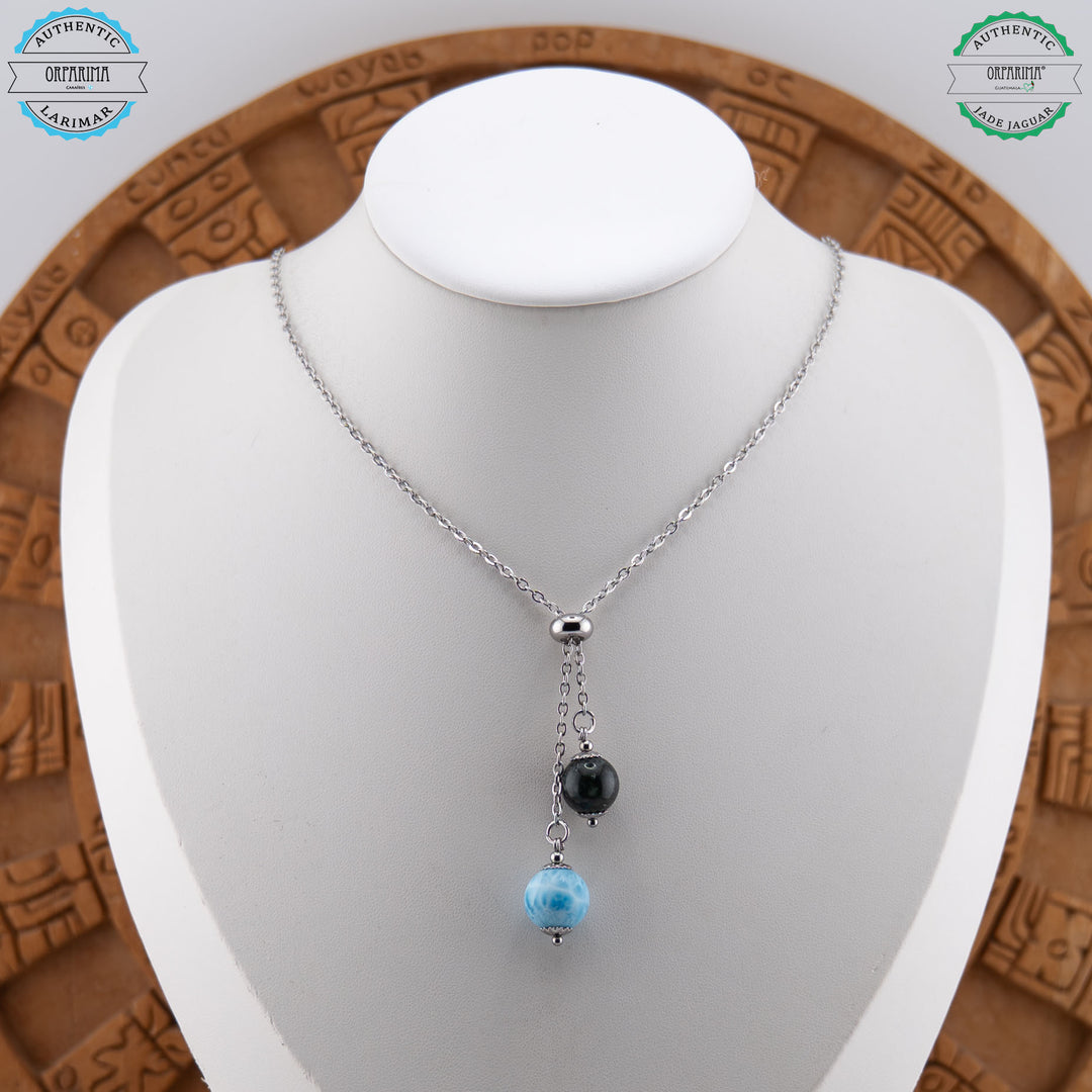 superbe collier argenté en acier inoxydable 316L avec une bague en caoutchouc et deux perles pendantes. L&